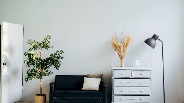 a white couch and a black dresser in a room at The  Hargrove at Southpoint