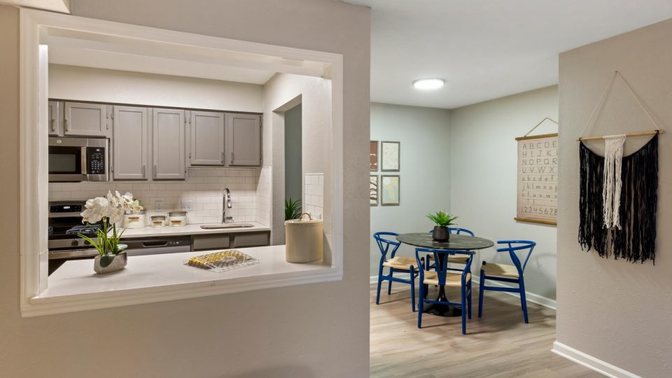 a kitchen and dining area in a new apartment at The  Hargrove at Southpoint