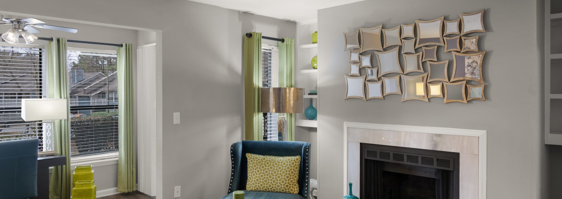 a living room with a fireplace and a couch at The  Hargrove at Southpoint